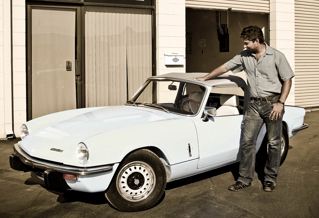 Jalal standing beside the 
instrumented Triumph Spitfire